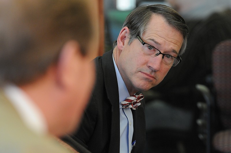 Sen. Bo Watson listens to Rep. Mike Carter during the Times Free Press sponsored Legislative Roundtable at the newspaper in this file photo.