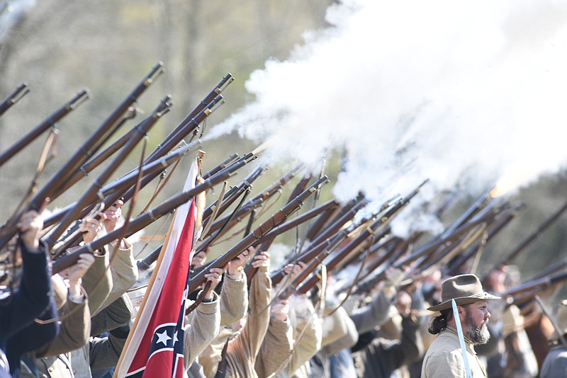 Re-enactors fire a volley salute to spectators after the annual Siege of Bridgeport Civil War Re-enactment on Sunday, March 29, 2015, in Bridgeport, Ala. 