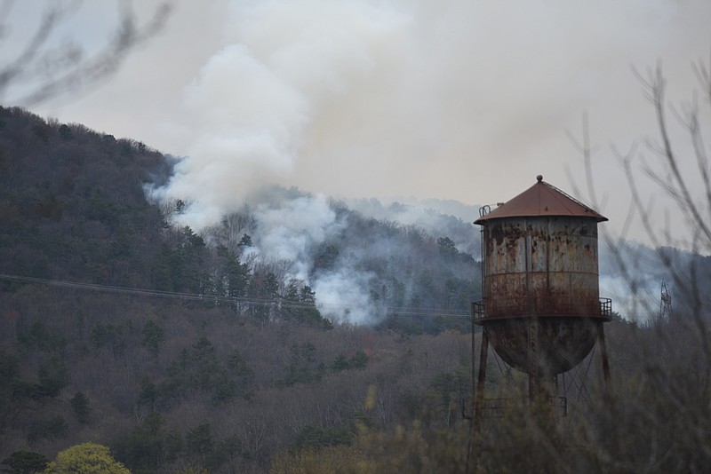 A brush fire burns up the side of Walden's Ridge on Sunday, March 29, 2015, in Soddy-Daisy. The fire started around 5 p.m., and winds caused it to spread up and over the bluff at Mowbray Mountain. 
