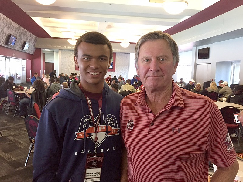 Dominick Blaylock stand with Steve Spurrier.