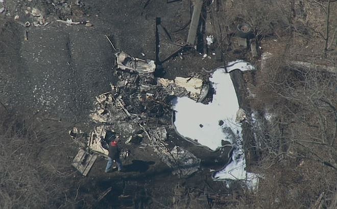 This aerial image made from a video provided by NBC10 shows the scene of a small plane crash in Chester County, Pa., near the Brandywine airport, Sunday, March 29, 2015. The crash took the lives of the only two people aboard the aircraft, authorities said. 