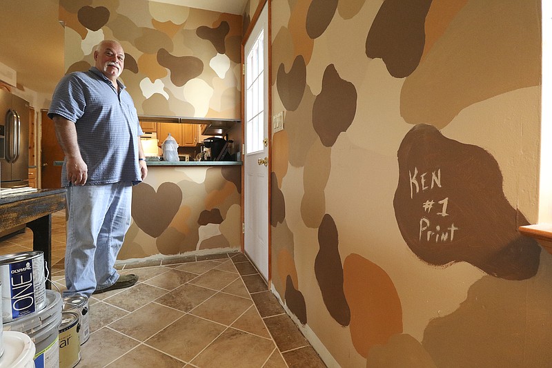 Ken Moses surprised his wife by painting a camouflage pattern on their Ooltewah residence's dining room while she was out of town. He did this after he and his wife Kim had difficulty deciding on a color as an early April fools joke. 