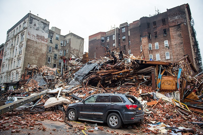 
              FILE - In this March 27, 2015, file photo, a pile of debris remains at the site of a building explosion in the East Village neighborhood of New York. While officials caution that they aren’t certain of the cause of last week’s blast in New York’s East Village, it is highlighting a long-known problem with potentially deadly consequences: untrained schemers rigging up pipes to save money by siphoning natural gas. (AP Photo/The New York Times, Nancy Borowick, Pool, File)
            