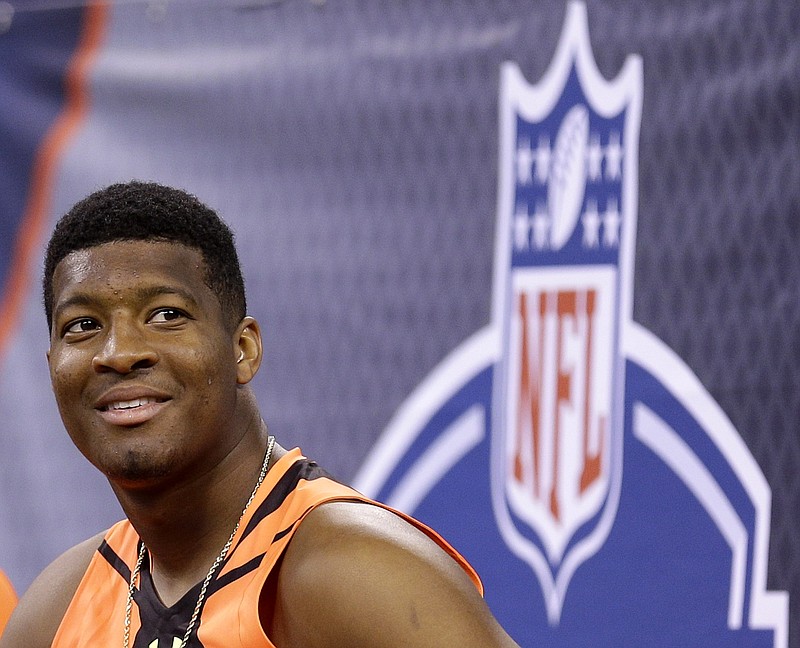 
              FILE - This is a Feb. 21, 2015, file photo showing Jameis Winston at the NFL football scouting combine in Indianapolis. Winston has spent much of the past two months crisscrossing the nation, sharpening his quarterback skills and trying to convince NFL teams he's learned from mistakes made off the field and ready to become the face of a franchise. (AP Photo/David J. Phillip, File)
            