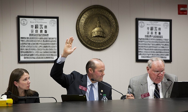 State Rep. Barry Fleming, R - Harlem, raises his hand to vote on an amendment during a House subcommittee panel on a "religious freedom" bill, Wednesday, March 25, 2015, in Atlanta.