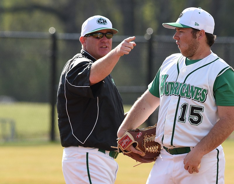 East Hamilton head baseball coach Steve Garland points to first base from the mound Tuesday during the Walker Valley game. Pitcher Hunter Smith (15) was not the subject of the comments.