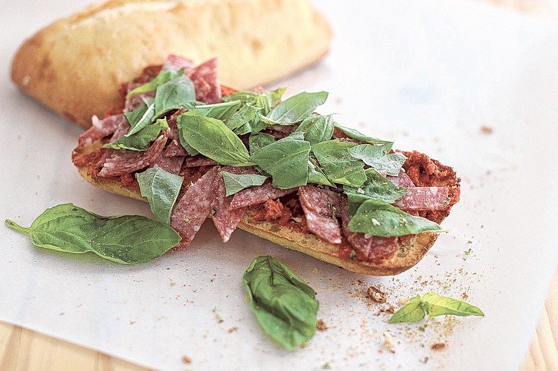 Tomato butter and salami toast: Butter, tomato paste and capers spread over ciabatta toast, then topped with shredded salami and torn fresh basil.