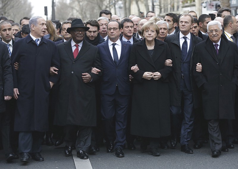 
              FILE - This Sunday, Jan. 11, 2015 file photo shows from left : Israeli Prime Minister Benjamin Netanyahu, Malian President Ibrahim Boubacar Keita, French President Francois Hollande, German Chancellor Angela Merkel, EU President Donald Tusk and Palestinian Authority President Mahmoud Abbas marching during a rally in Paris, France. France sees a window of opportunity after Israel’s elections to get the United States on board with a new push for Mideast peace, and is preparing to present a draft U.N Security Council resolution in about 12 days, according to French diplomatic officials. The draft would define the pre-1967 frontier as a reference point for border talks but allow room for exchanges of territory, designate Jerusalem as a capital of two states and call for a fair solution for Palestinian refugees, one official told The Associated Press on Tuesday. (AP Photo/Philippe Wojazer, Pool, File)
            