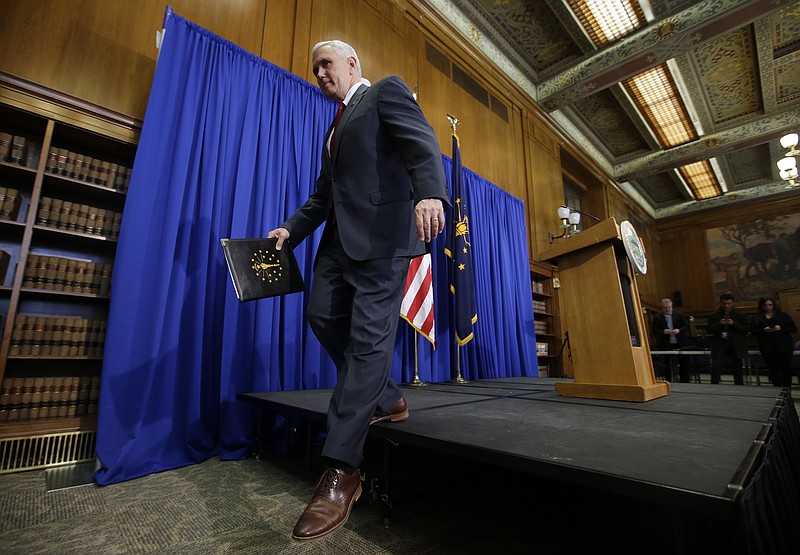 Indiana Gov. Mike Pence steps off the podium after a news conference discussing the state's new religious-freedom law, Tuesday, March 31, 2015, in Indianapolis.