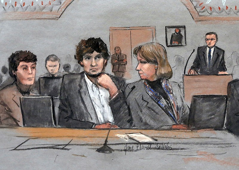 
              FILE - In this March 5, 2015 file courtroom sketch, Dzhokhar Tsarnaev, center, is depicted between defense attorneys Miriam Conrad, left, and Judy Clarke, right, during his federal death penalty trial in Boston.  Prosecutors rested their case against Tsarnaev on Monday, March 30, 2015, after jurors saw gruesome autopsy photos and heard a medical examiner describe the devastating injuries suffered by the three people who died in the 2013 terror attack. (AP Photo/Jane Flavell Collins, File)
            