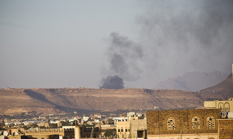 
              Smoke rises from an area due to Saudi-led airstrikes in Sanaa, Yemen, Monday, March 30, 2015. (AP Photo/Hani Mohammed)
            