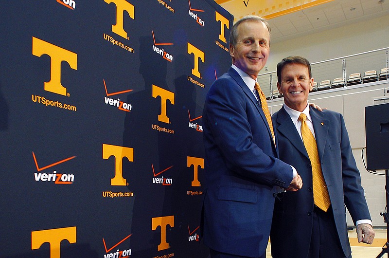 Former University of Texas head basketball coach Rick Barnes, left, shakes hands with athletic director Dave Hart after being named the new head coach at the University of Tennessee on Tuesday, March 31, 2015, in Knoxville.