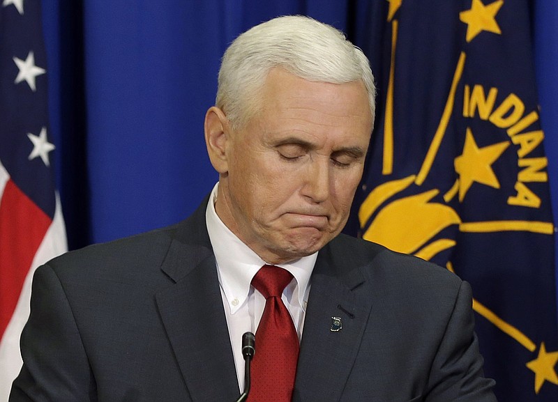 Indiana Gov. Mike Pence listens to a question during a news conference, Tuesday, March 31, 2015, in Indianapolis.