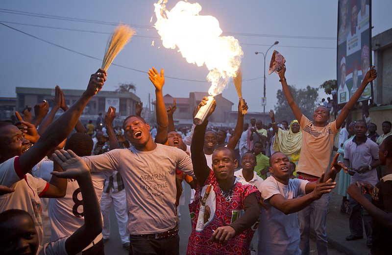 Supporters of opposition candidate Muhammadu Buhari celebrate an anticipated win for their candidate, in Kano, Nigeria, on Tuesday, March 31, 2015.