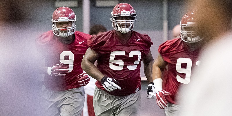 Alabama defensive lineman Jonathan Taylor (53) jogs from station to station during Alabama's first spring football practice  at the Thomas-Drew Practice Fields in Tuscaloosa, Ala., in this March 13, 2015 photo.