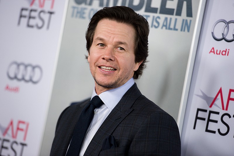 
              FILE - In this Nov. 10, 2014 file photo, Mark Wahlberg arrives at the 2014 AFI Fest - "The Gambler," in Los Angeles. Wahlberg, along with Scott Stuber, Dylan Clark, Stephen Levinson and Michael Radutzky, will produce "Patriots' Day," a film chronicling the events surrounding the 2013 Boston Marathon Bombing, based on the first-hand account of Boston Police Commissioner Ed Davis. Matt Charman is writing the screenplay and Nicholas Nesbitt will executive produce. (Photo by Richard Shotwell/Invision/AP, File)
            