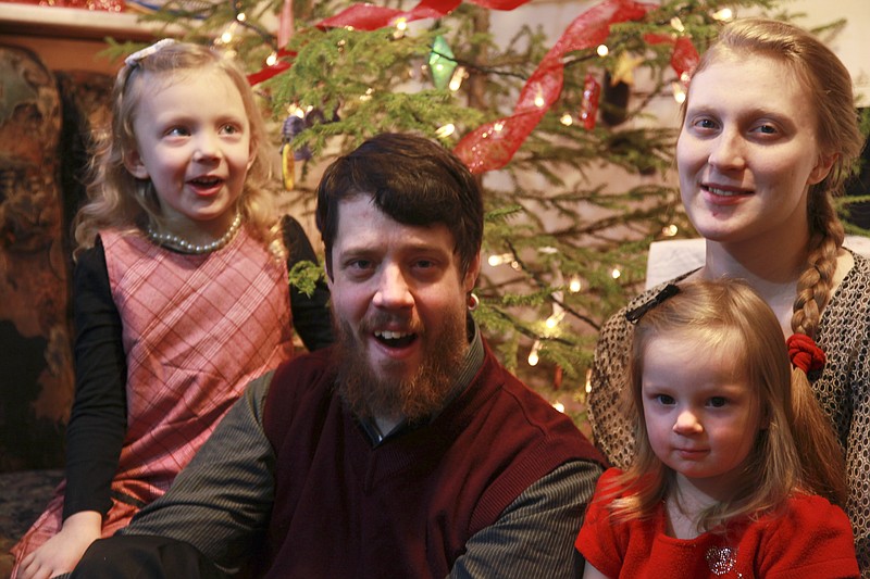 
              In this handout photo taken on Wednesday, Dec.  31, 2014, Justus Walker, center, poses with his family for a family photo near the eastern Siberian city of Krasnoyarsk, Russia. A Kansas-born farmer who uses his Siberian dairy smallholding to support his missionary work, Walker is among the winners in the year since Russia was hit by US and EU sanctions. He shot to fame in August, shortly after the Russian government banned food imports from the U.S. and much of Europe in response to what Russia says are unjustified sanctions against it over the Ukraine conflict. (AP Photo/ Justus Walker/ HO)
            