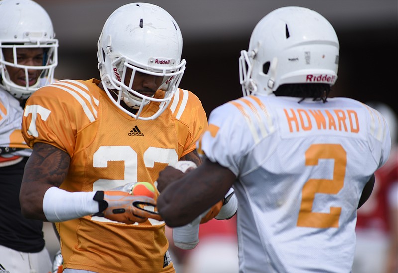 Pig Howard, right, participates in practice at Haslam Field in Knoxville on March 31, 2015.
