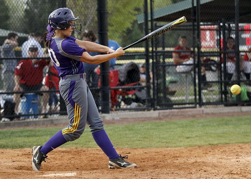 Central's Destiny Payton drives in the mercy-rule winning run of their Lady Trojan Invitational softball tournament game against Sullivan East on Friday, April 3, 2015, at Warner Park in Chattanooga.