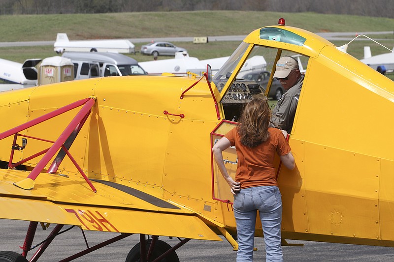 Contest manager Sarah Arnold speaks to Frank McDonald Friday, March 3, 2015, before he tows a glider up for practice during the first FAI Pan American Gliding Championships being held at McMinn County Airport from April 3 through the 17th.