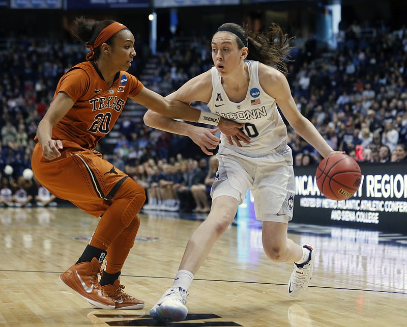 
              FILE - In this March 28, 2015 file photo, Connecticut forward Breanna Stewart (30) drives against Texas guard Brianna Taylor (20) during the first half of a women's college basketball regional semifinal game in the NCAA Tournament in Albany, N.Y. (AP Photo/Mike Groll, File)
            