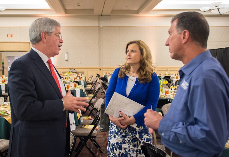 Hamilton County School Superintendent Rick Smith speak with Tammy Zumbrun and John Merritt in this March 18, 2015, file photo.