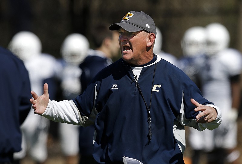 UTC head football coach Russ Huesman shouts to players during the Mocs' first spring football scrimmage Saturday, March 28, 2015, at Scrappy Moore Field in Chattanooga.