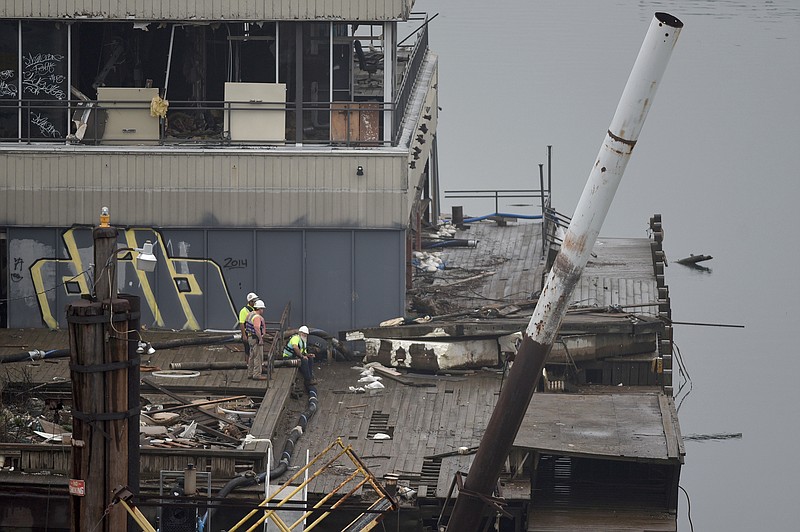 The first floor of the Casey barge is seen above water in this April 7, 2015, file photo. 