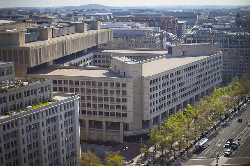 The J. Edgar Hoover building Federal Bureau of Investigation's (FBI) headquarters in Washington, Saturday, April 26, 2014. The FBI is looking to consolidate its headquarters, located just six blocks from the White House, which it has occupied on Pennsylvania Avenue since its completion in 1974, and 20 leased locations to a new campus within two miles of a Metro station and 2 1/2 miles of the Capital Beltway. Has prompting a furious battle among local jurisdictions to have the FBI find a new home in their states. (AP Photo/Pablo Martinez Monsivais)
