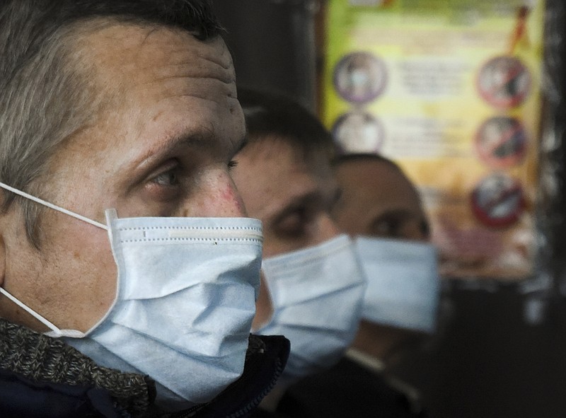 In this photo taken on Thursday, March 26, 2015 prisoners of Zhdanivskaya prison listen to a lecture by a social worker in the village of Zhdanivka, eastern Ukraine. Medical supplies have been in short supply, threatening the lives of nearly 400 prisoners who need treatment. The principal scourge: Tuberculosis. The disease spreads prodigiously in jails and develops into hard-to-treat forms unless properly addressed. "TB is so common within the penitentiary system that many inmates don't see it as a deadly disease _ they see catching TB as a normal part of life in prison," Doctors Without Borders said in a recent situation report. "Some even tell us they don't care if they die or not." (AP Photo/Mstyslav Chernov)
            