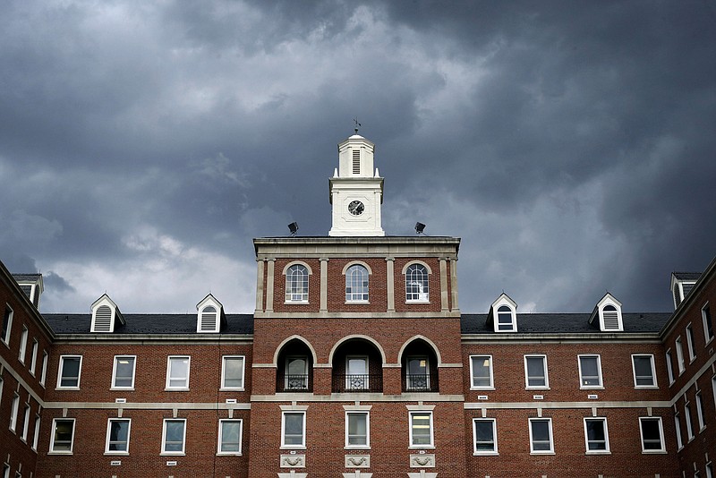 
              In this March 11, 2015 photo, storm clouds roll over the Fayetteville Veterans Affairs Medical Center in Fayetteville, N.C. North Carolina is home to the Army's Fort Bragg, the Marines' Camp Lejeune, and nine of the 50 VA medical facilities with the most patients waiting more than 30 days for care. Fayetteville VAMC director Elizabeth Goolsby attributed problems to a variety of factors, but said the region has experienced an 8 percent increase in patient utilization per year. "We've been at war for 13 years," she said. Floods of young veterans who fought in Afghanistan and Iraq are leaving the service and enrolling in the VA care system for the first time, she said. (AP Photo/Patrick Semansky)
            