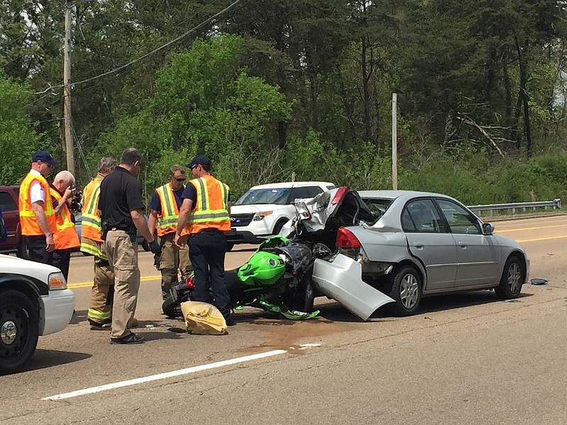 Chattanooga officers and firefighters work a wreck on Highway 153 just north of Grubb Road.
