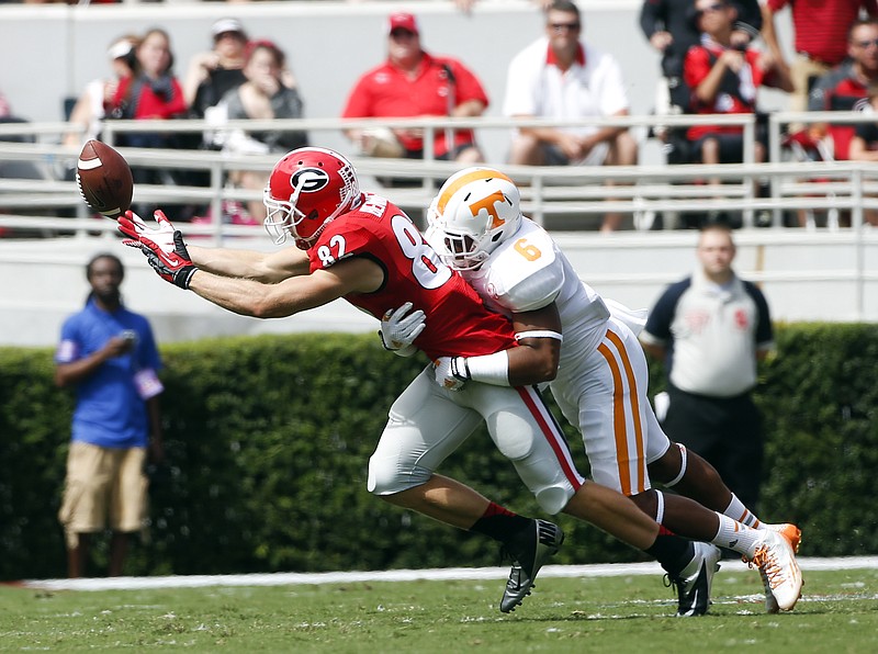 Georgia wide receiver Michael Bennett (82) can't reach a pass as Tennessee defensive back Todd Kelly Jr. (6) defends during their game on Sept. 27, 2014, in Athens, Ga. 