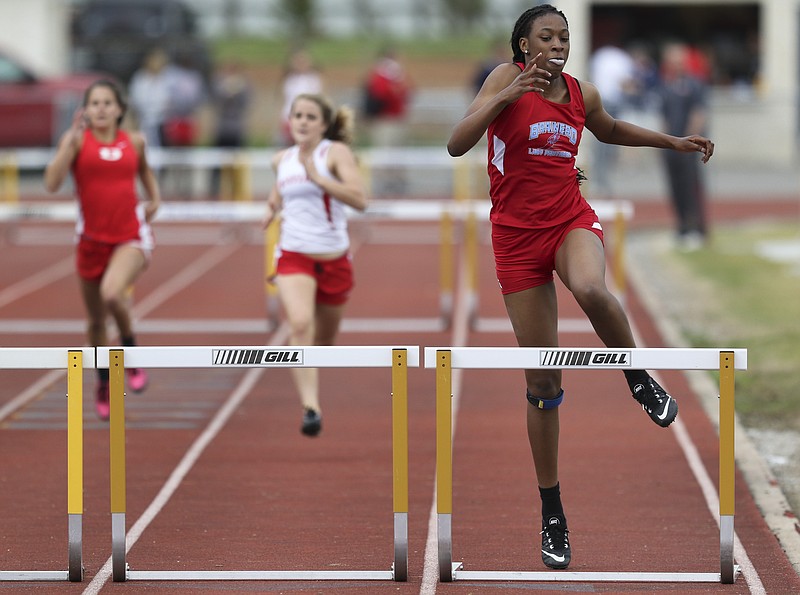 Brainerd High School athlete Ebony Calloway takes first overall with a time of 47.98 while competing in the Chattanooga Optimist Southeastern Track & Field Invitational varsity girls 300 meter hurdle event at Walker Valley High School on Friday, April 10, 2015. 