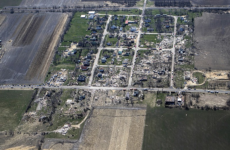 
              This aerial photo shows a path of destruction Friday, April 10, 2015, after a tornado swept through the small town of Fairdale, Ill., in DeKalb County Thursday night. The National Weather Service says at least two tornadoes churned through six north-central Illinois counties. Illinois Gov. Bruce Rauner declared DeKalb and Ogle counties affected by the severe storms and tornadoes as disaster areas.  (AP Photo/Daily Chronicle, Danielle Guerra)  CHICAGO TRIBUNE OUT, MANDATORY CREDIT
            