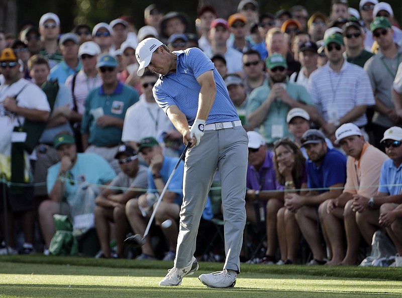 Jordan Spieth tees off on the 17th tee during the third round of the Masters golf tournament Saturday, April 11, 2015, in Augusta, Ga. 