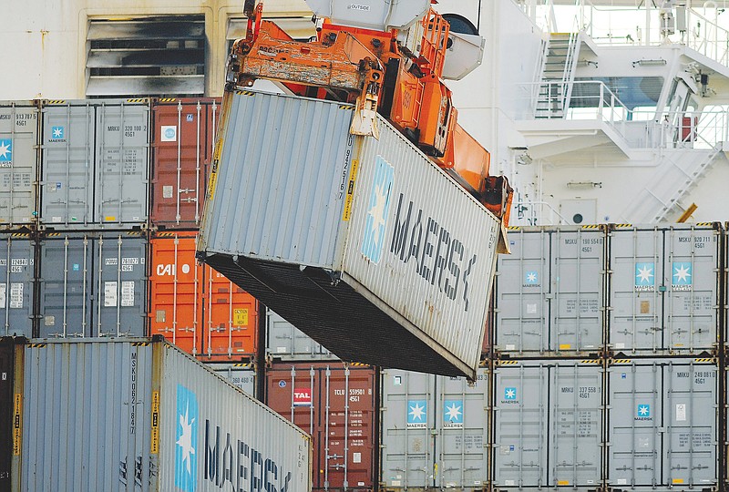 A ship-to-shore crane unloads a shipping container at the Georgia Ports Authority Garden City terminal Jan. 27, 2014, in Savannah, Ga.