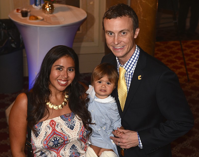 New UTC men's basketball coach Matt McCall, right, his wife, Allison McCall, and daughter Brooklyn McCall attend a reception at the Tivoli Theater on Monday, Aug. 13, 2015, in Chattanooga prior to the first "Scrappys" award ceremony honoring UTC athletes. 