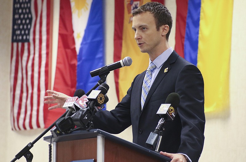 Matt McCall speaks during a news conference announcing him as the University of Tennessee at Chattanooga's new head men's basketball coach while at the UTC University Center on Monday, April 14, 2015.