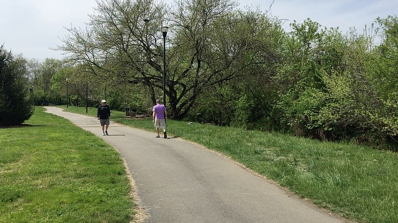 Residents walk on the greenway in Cleveland, Tenn.