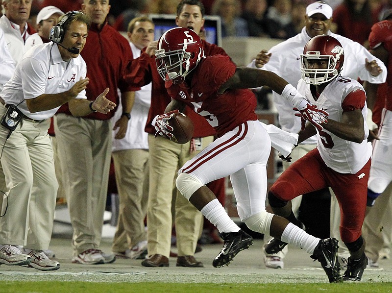 Alabama head coach Nick Saban reacts to defensive back Cyrus Jones (5) intercepting a pass intended for Arkansas wide receiver Eric Hawkins (5) during the second half of an NCAA college football game on Saturday, Oct. 19, 2013, in Tuscaloosa, Ala.