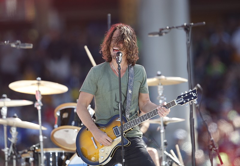 
              FILE- In this Sept. 4, 2014, file photo, Chris Cornell, of Soundgarden, performs with his band at the NFL football Kickoff concert in Seattle. Cornell said Tuesday, April 14, 2015, that the co-founder of a famed Seattle recording studio has no legitimate claim to own the master tapes of a defining album of the grunge era — "Temple of the Dog," which Cornell recorded with Eddie Vedder and other members of Pearl Jam in 1990. (AP Photo/Scott Eklund, File)
            