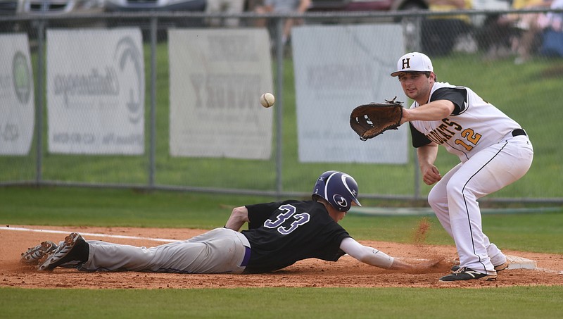 Central's Scout Morgan slides safely back to first as Hixson's Parker Tyo waits for the ball Wednesday at Hixson High School. 