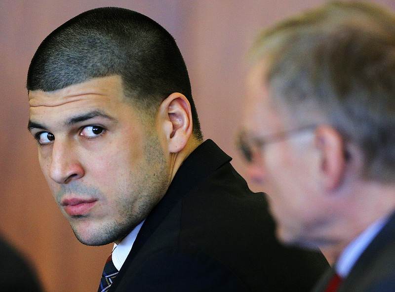 Former New England Patriots tight end Aaron Hernandez, left, attends a pretrial hearing in Fall River, Mass., in this Dec. 22, 2014 file photo.