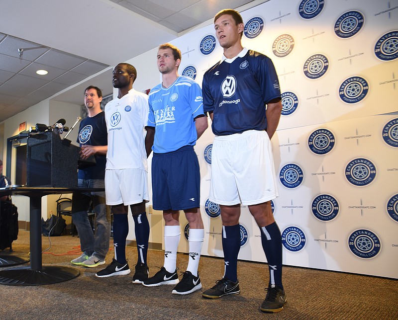 Paul Rustand, left, introduces CFC players Chris Ochieng, left, John "Snoop" Davidson and Sias Reyneke in the team's new uniforms for the 2015 season at Finley Stadium on April 16, 2015.