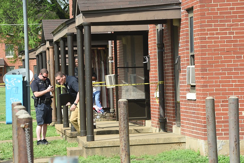 Chattanooga Police investigators work a homicide in College Hill Courts on April 15, 2015.
