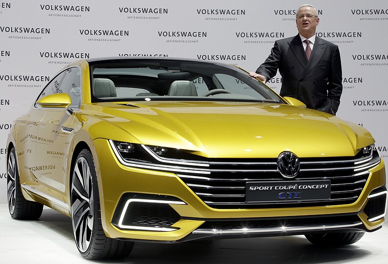  Volkswagen CEO Martin Winterkorn poses for the media beside a  GTE  concept car prior to the company's annual press conference in Berlin, Germany, in this March 12, 2015. file picture.