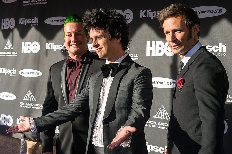 The members of the band Green Day pose for photographers prior to the 2015 Rock And Roll Hall Of Fame Induction Ceremony at Public Hall on Saturday, April 18, 2015, in Cleveland, Ohio.