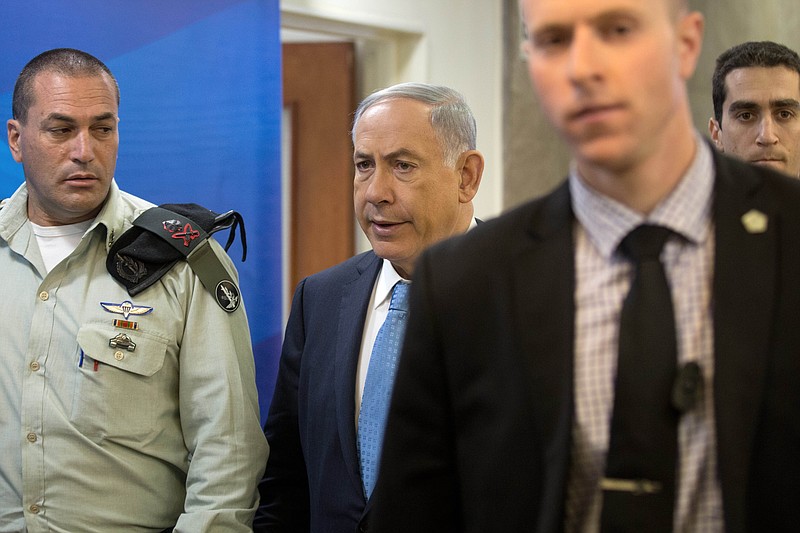 
              Israeli Prime Minister Benjamin Netanyahu arrives for the weekly cabinet meeting at his Jerusalem office, Sunday, April 19, 2015. (AP Photo/Menahem Kahana, Pool)
            