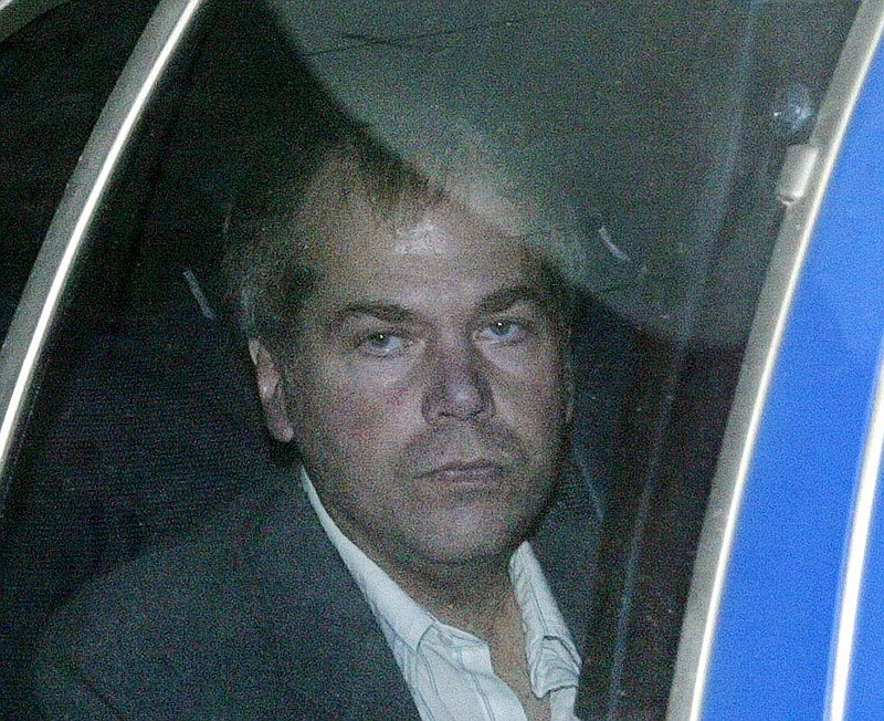 
              FILE - In this Nov. 18, 2003 file photo, John Hinckley Jr. arrives at U.S. District Court in Washington. The last man to shoot an American president now spends most of the year in a house overlooking the 13th hole of a golf course in a gated community. He takes long walks along tree-lined paths, plays guitar and paints, grabs fast food at Wendy’s. He drives around town in a silver Toyota Avalon, a car that wouldn’t attract a second glance. Often, as if to avoid detection, he puts on a hat or visor before going out. (AP Photo/Evan Vucci, File)
            